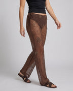 Women's Elegant Transparent Wide-Cut Pants with Embellished Details - Lower Body View