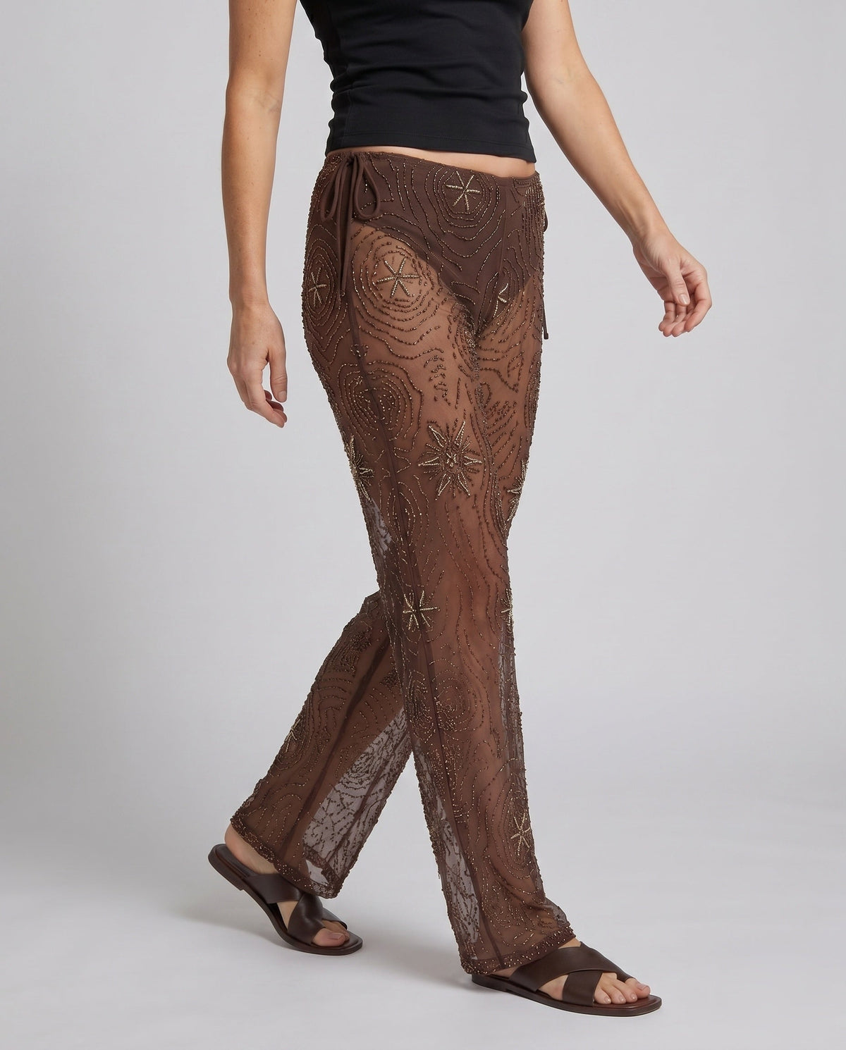 Women's Elegant Transparent Wide-Cut Pants with Embellished Details - Lower Body View