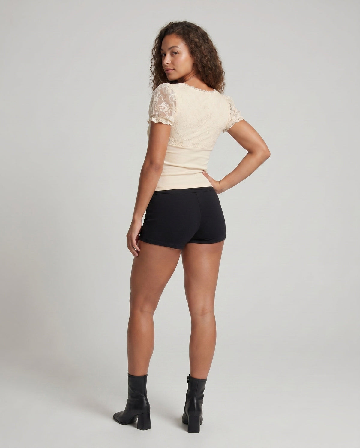 Women's Lace Top with Voluminous Ruffle Edges and an Elegant Waistband - Back View