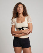 Women's Lace Top with Voluminous Ruffle Edges and an Elegant Waistband - Upper Body View
